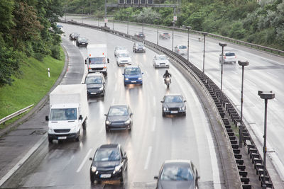 High angle view of vehicles moving on highway during monsoon