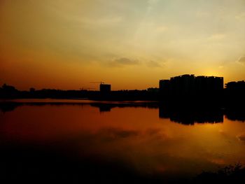 View of calm lake at sunset