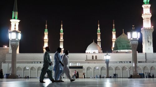 View of illuminated buildings in city at night