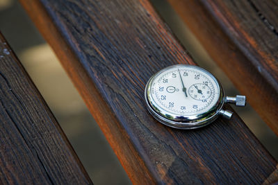 Close-up of pocket watch on table