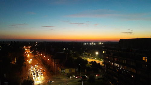 High angle view of illuminated city at night