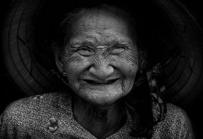 Portrait of smiling senior woman wearing hat