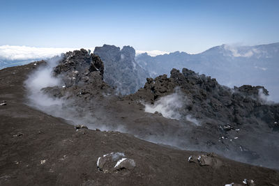 Scenic view of rocky mountains against sky