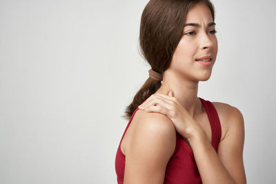 Portrait of a beautiful young woman over white background