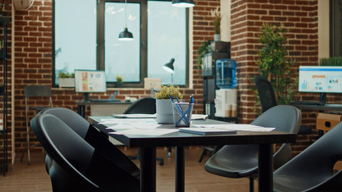 Empty chairs and tables in cafe