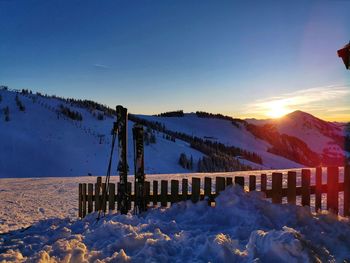 Scenic view of snowcapped mountains against sky during sunset