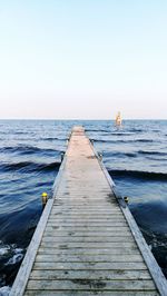 View of pier on calm sea