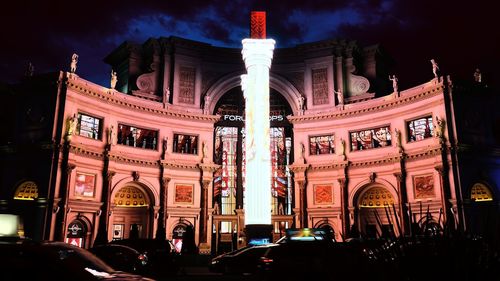 Low angle view of illuminated building at night