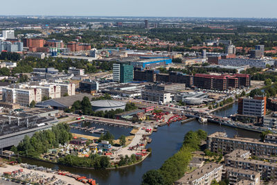 High angle view of river amidst buildings in city