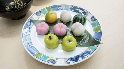 High angle view of eggs in plate on table