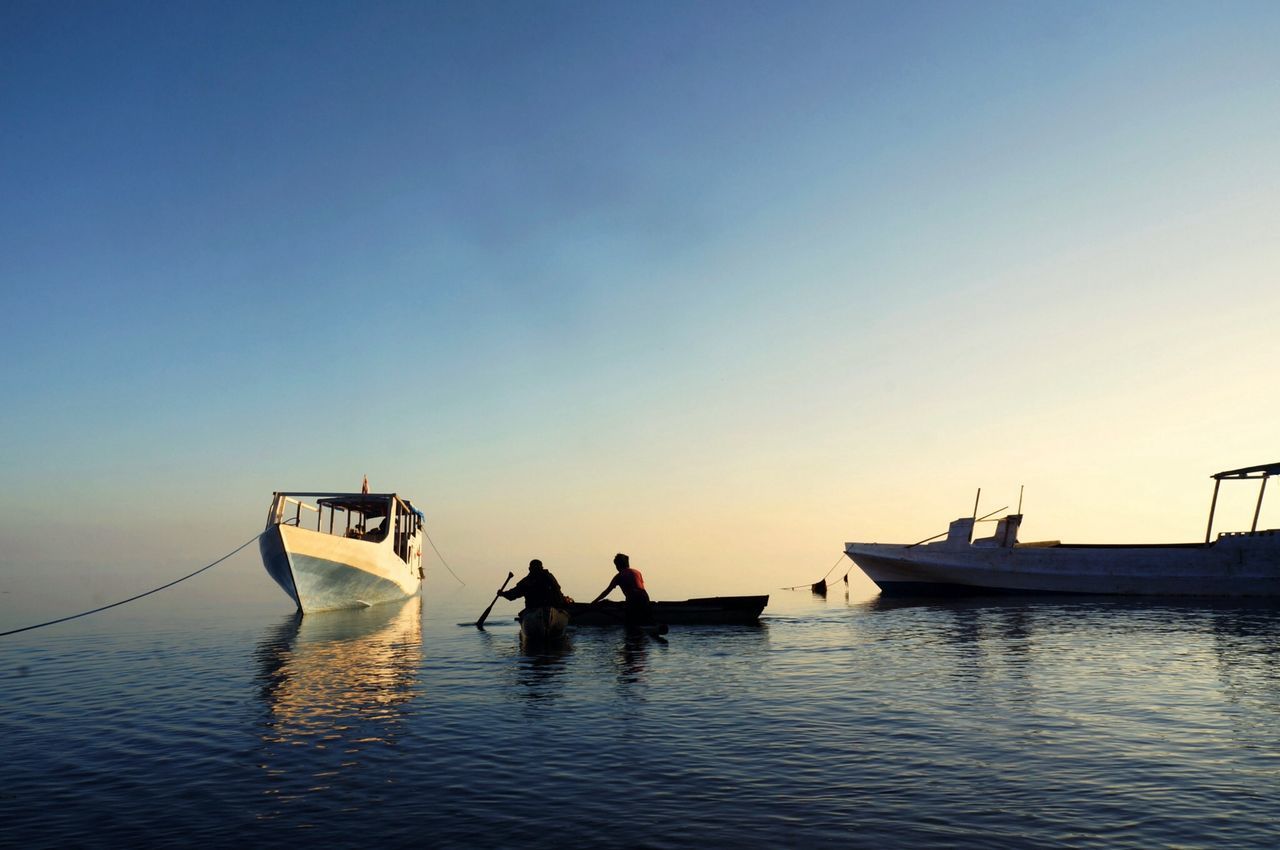 transportation, nautical vessel, mode of transport, water, clear sky, boat, copy space, waterfront, silhouette, sunset, sea, travel, tranquility, tranquil scene, nature, scenics, moored, sailing, dusk, outdoors