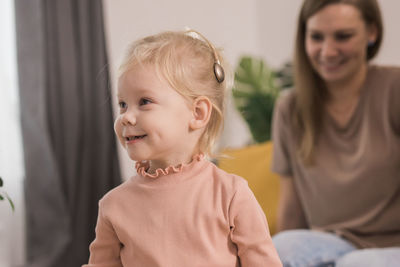 Portrait of girl looking away at home