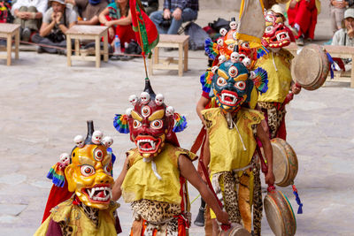 People wearing mask walking outdoors