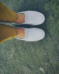 Low section of woman standing on floor