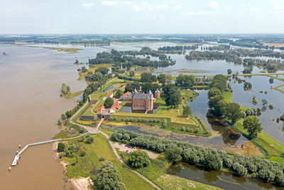 Aerial from castle loevestein at the river merwede in a flooded landscape in the netherlands