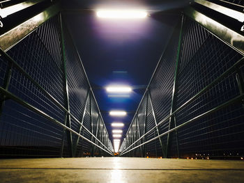 Illuminated bridge at night