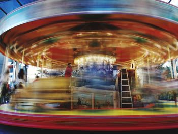Blurred motion of carousel at amusement park