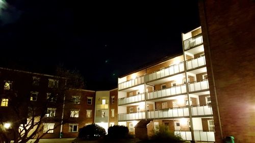 Buildings in city at night