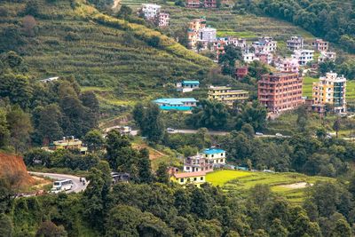 High angle view of townscape and trees in city