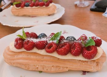 High angle view of strawberries in plate on table