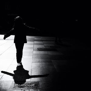 Woman standing at night