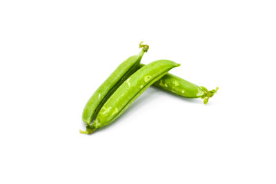 Close-up of green chili pepper against white background