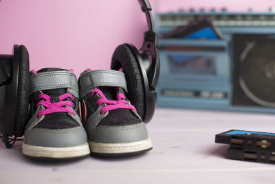 Close-up of shoes on table