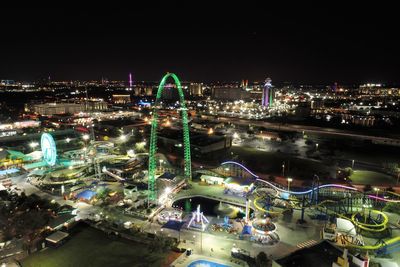 High angle view of illuminated city buildings at night