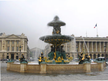 Statue of fountain against sky