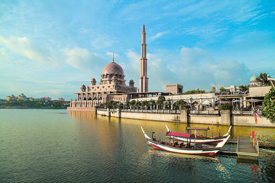 Mosque in putrajaya against cloudy sky