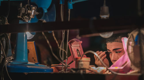 Midsection of woman working in restaurant