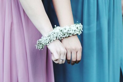 Close-up of woman hand holding blue flower