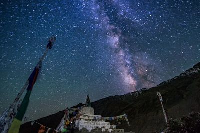 Low angle view of temple against sky at night