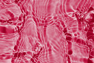 Viva magenta water texture background. abstract pattern