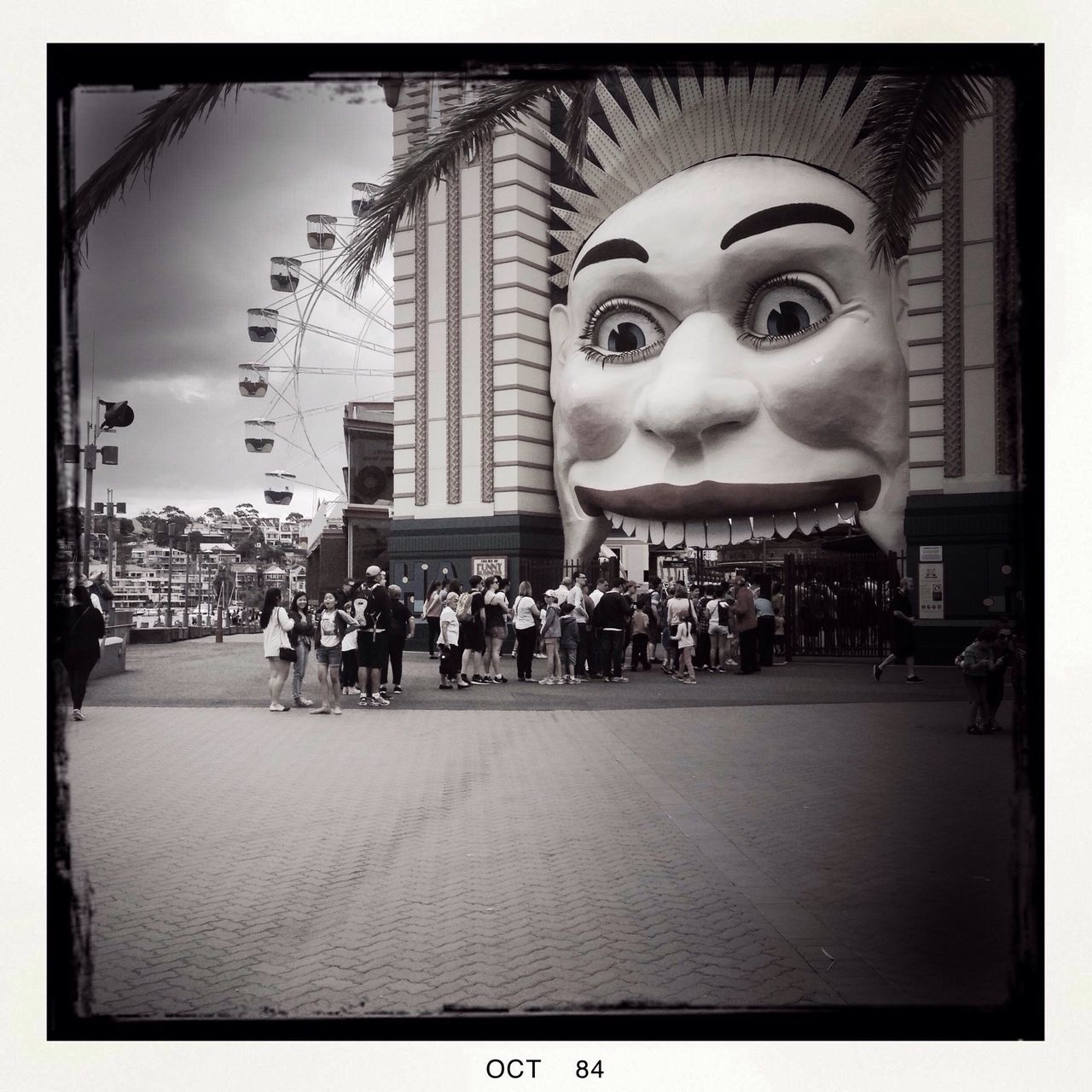 transfer print, auto post production filter, architecture, building exterior, built structure, large group of people, human representation, city, sculpture, art, lifestyles, art and craft, creativity, leisure activity, men, sky, outdoors, day