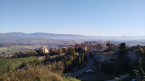 High angle view of buildings against clear sky