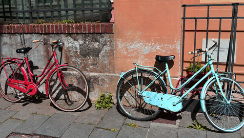 Bicycle parked against wall