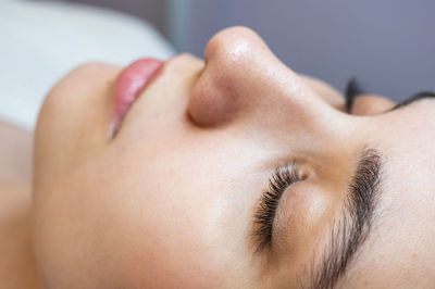 Close-up of young woman looking away