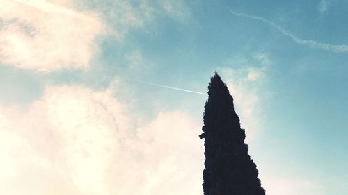 Low angle view of vapor trail against sky