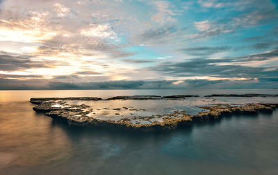 Scenic view of sea against sky during sunset