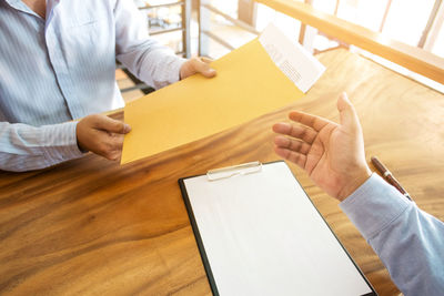 High angle view of man working on table