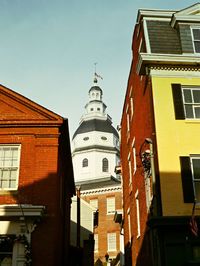 Low angle view of buildings against clear sky