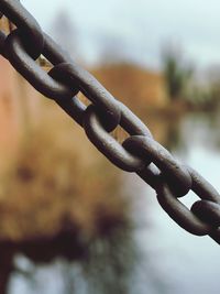 Close-up of chain against blurred background