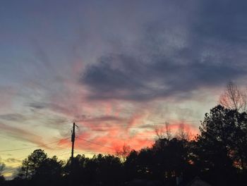 Low angle view of cloudy sky at sunset