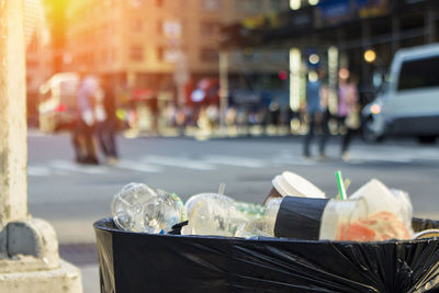 Close-up of ice cream on street in city