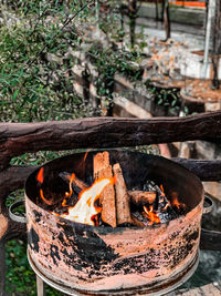 Close-up of bonfire on wooden structure