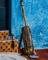 Clothes hanging on blue wall by sea