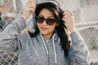 Portrait of young woman wearing sunglasses