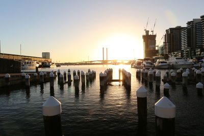 View of boats in sea at sunset