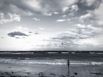 Scenic view of sea against cloudy sky